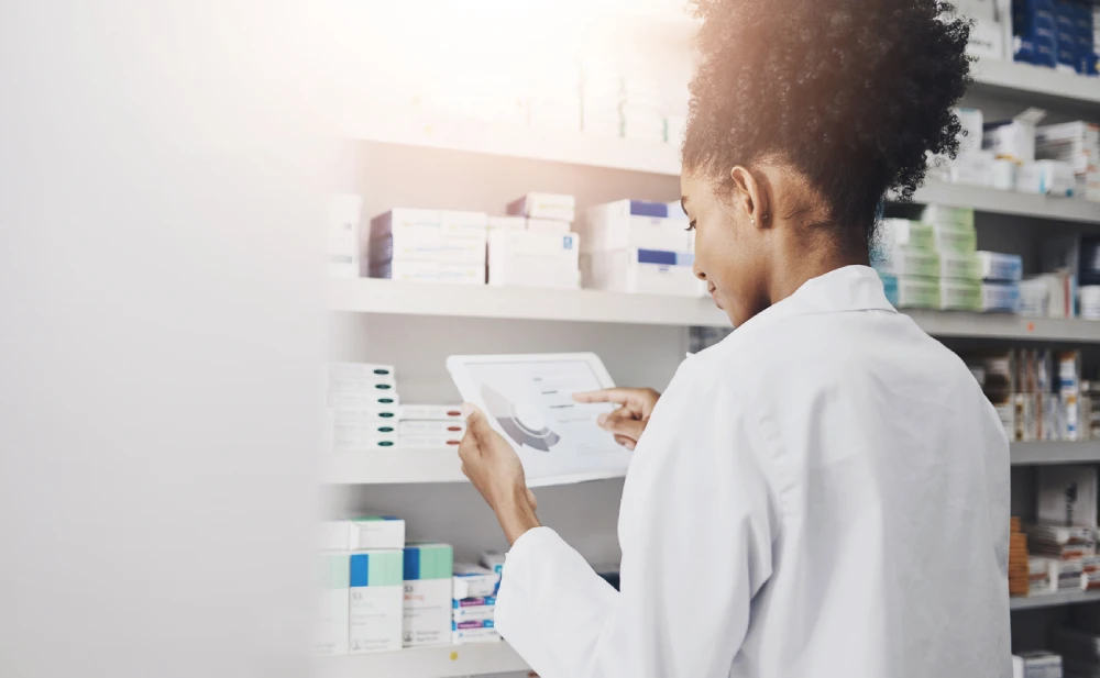 pharmacist assessing data for a pharmacy valuation