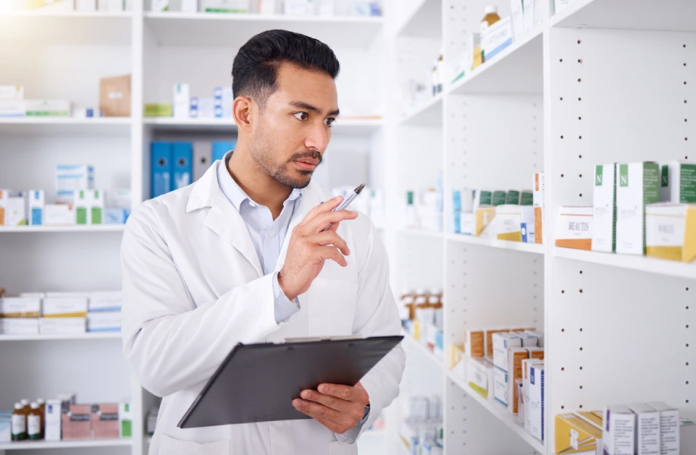 pharmacist taking inventory for a pharmacy valuation