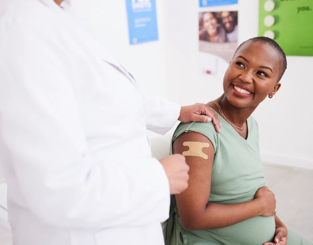 woman smiling at pharmacist